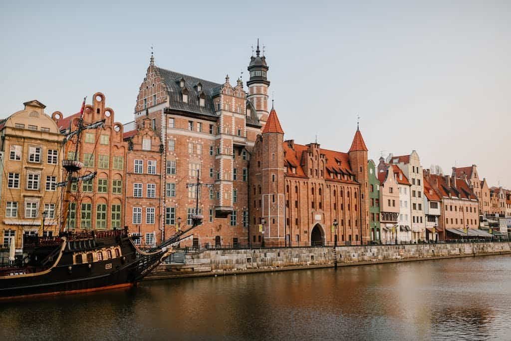 Old European city district on river coast