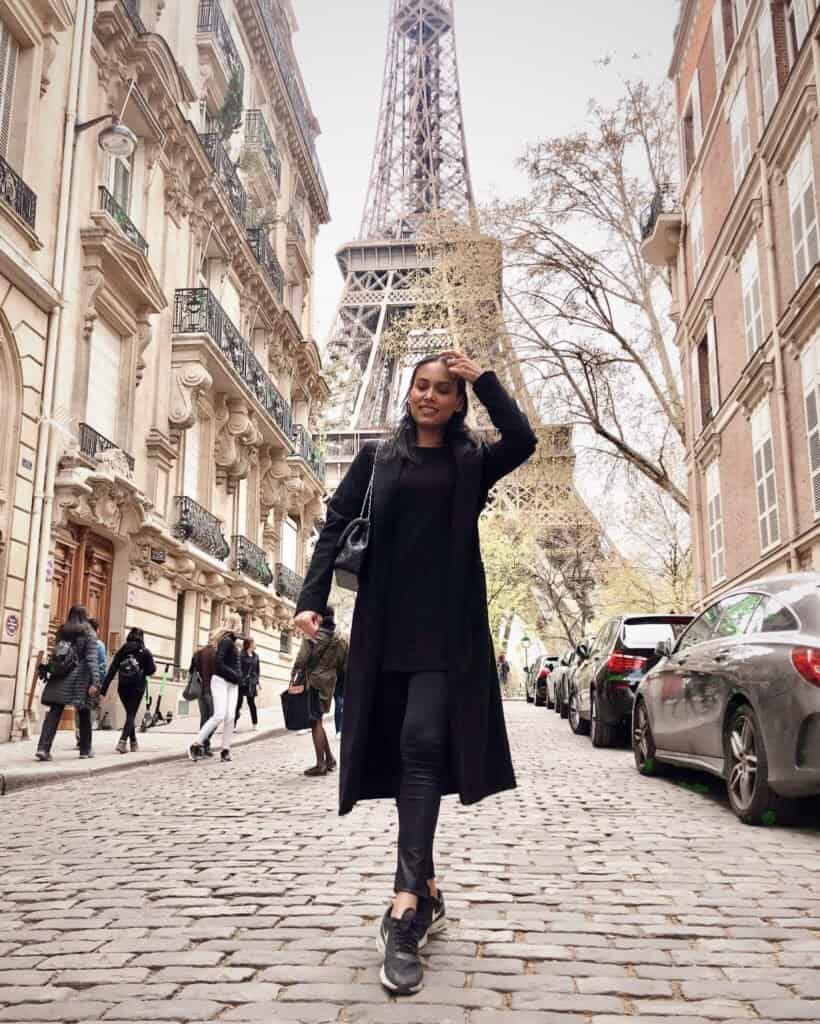 girl in front of eiffel tower what to eat in paris