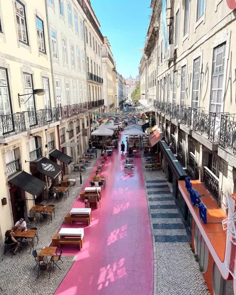 pink street in lisbon in summer jetlag sarah solo female travel guide to Portugal